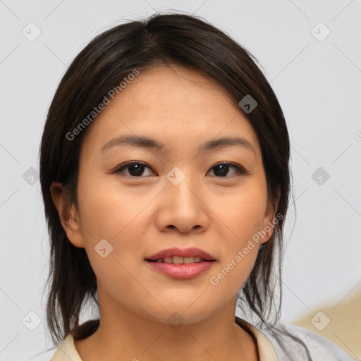 Joyful asian young-adult female with medium  brown hair and brown eyes