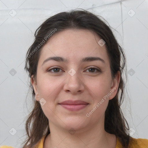 Joyful white young-adult female with medium  brown hair and grey eyes