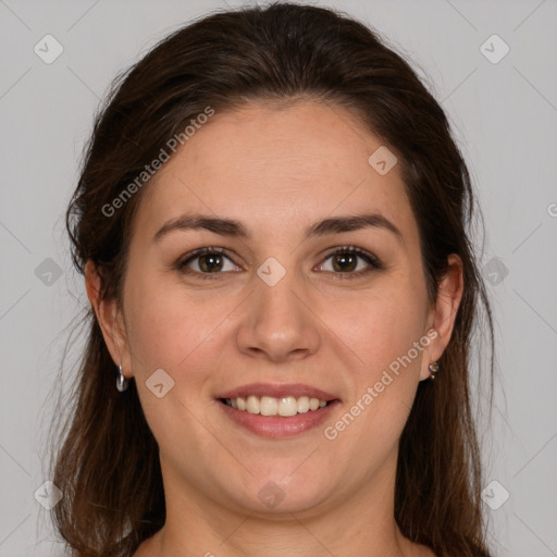 Joyful white young-adult female with long  brown hair and brown eyes