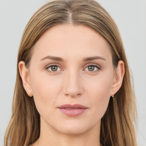 Joyful white young-adult female with long  brown hair and grey eyes