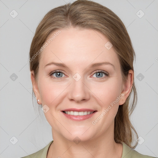 Joyful white young-adult female with medium  brown hair and grey eyes