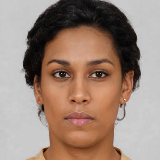 Neutral latino young-adult female with short  brown hair and brown eyes