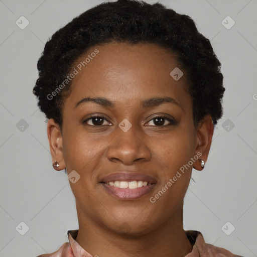 Joyful black young-adult female with short  black hair and brown eyes