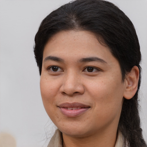 Joyful white young-adult female with long  brown hair and brown eyes