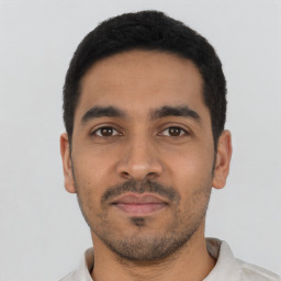 Neutral latino young-adult male with short  black hair and brown eyes