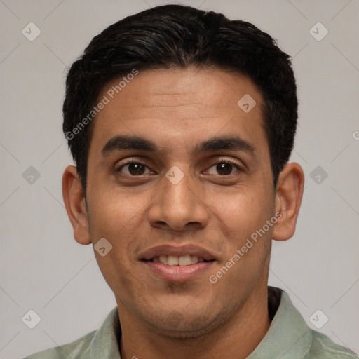 Joyful white young-adult male with short  black hair and brown eyes