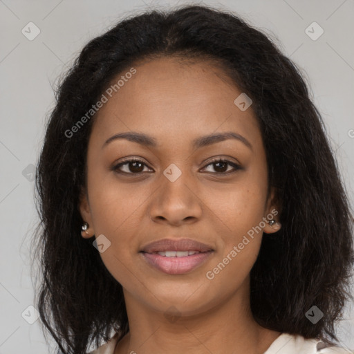 Joyful black young-adult female with long  brown hair and brown eyes