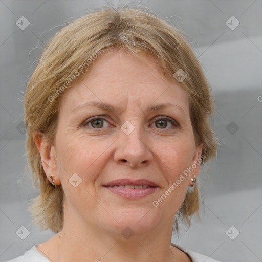 Joyful white adult female with medium  brown hair and blue eyes