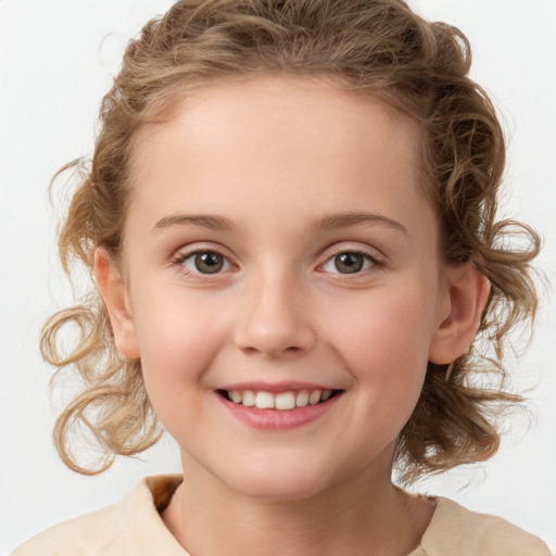 Joyful white child female with medium  brown hair and brown eyes