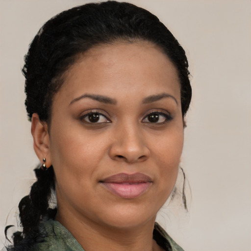 Joyful black young-adult female with medium  brown hair and brown eyes