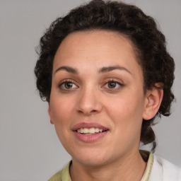 Joyful white young-adult female with medium  brown hair and green eyes