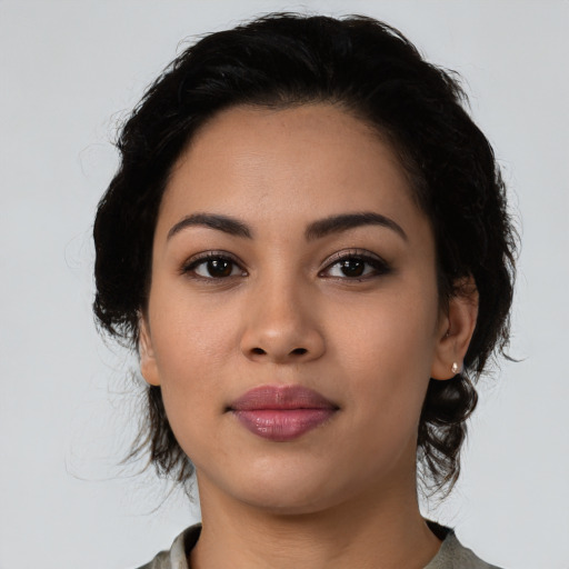 Joyful latino young-adult female with medium  black hair and brown eyes