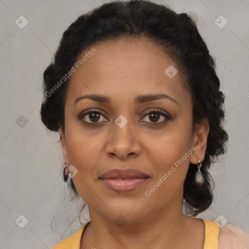 Joyful black adult female with medium  brown hair and brown eyes