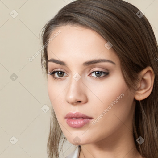 Neutral white young-adult female with long  brown hair and brown eyes