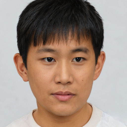 Neutral asian young-adult male with short  brown hair and brown eyes