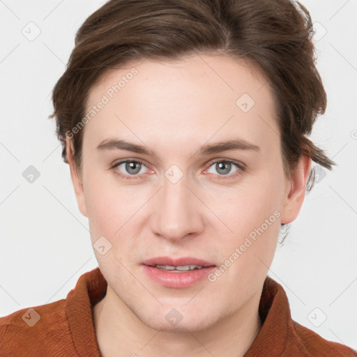 Joyful white young-adult female with short  brown hair and grey eyes