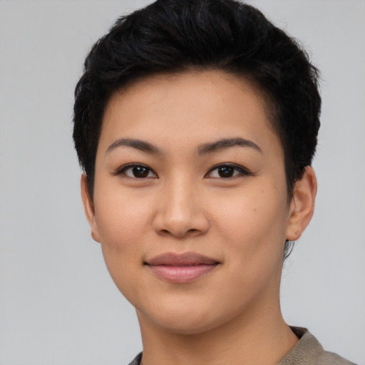 Joyful asian young-adult female with short  black hair and brown eyes