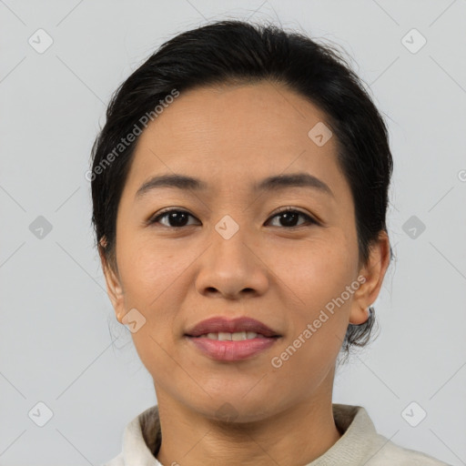 Joyful asian young-adult female with medium  brown hair and brown eyes