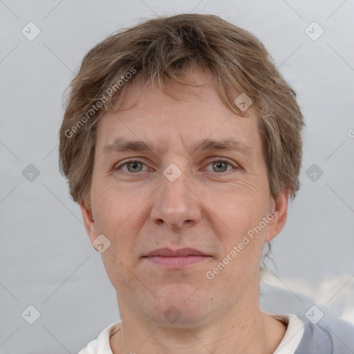 Joyful white adult male with short  brown hair and grey eyes