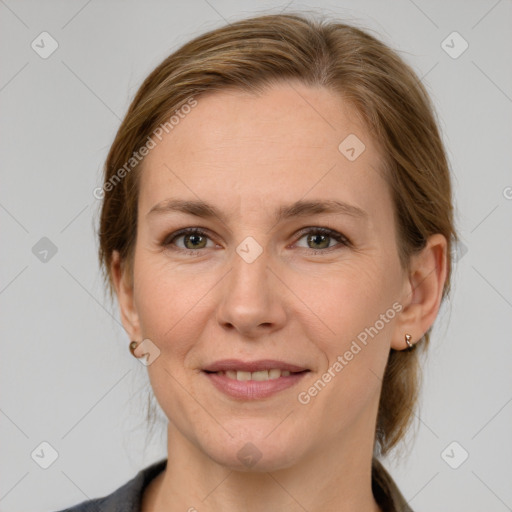 Joyful white adult female with medium  brown hair and grey eyes