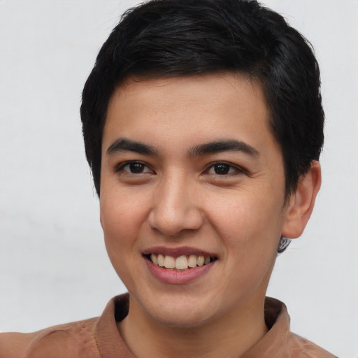 Joyful asian young-adult male with short  black hair and brown eyes