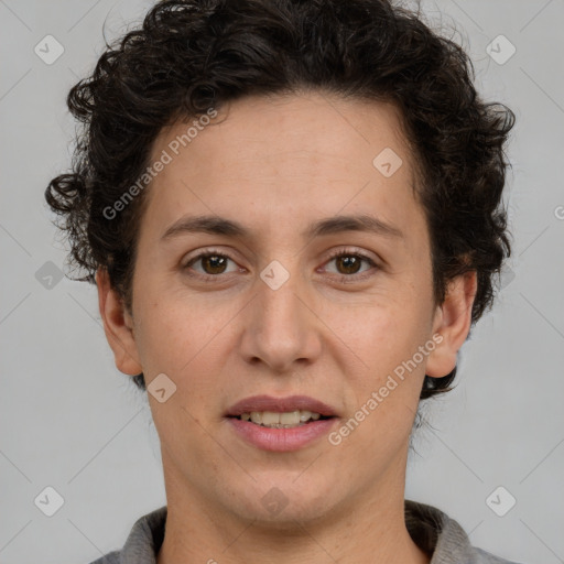 Joyful white adult female with short  brown hair and brown eyes