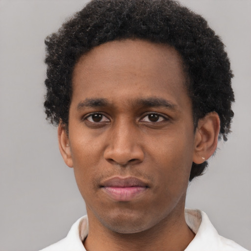 Neutral latino young-adult male with short  brown hair and brown eyes