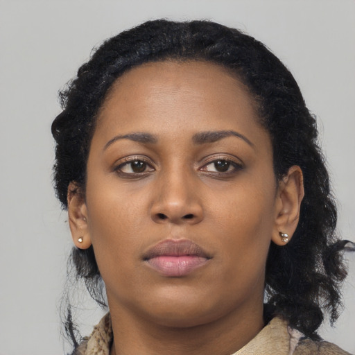 Neutral black young-adult female with medium  black hair and brown eyes