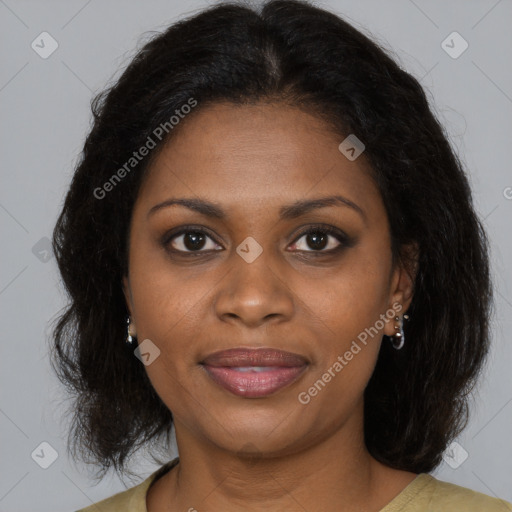 Joyful black adult female with medium  brown hair and brown eyes