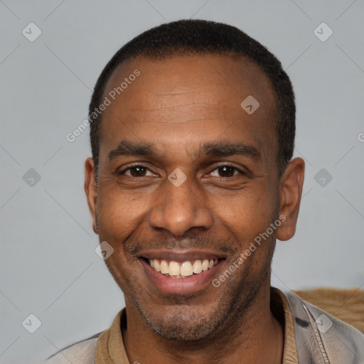 Joyful latino adult male with short  black hair and brown eyes