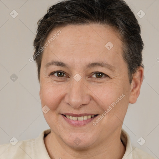 Joyful white adult female with short  brown hair and brown eyes