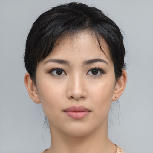 Neutral asian young-adult female with medium  brown hair and brown eyes