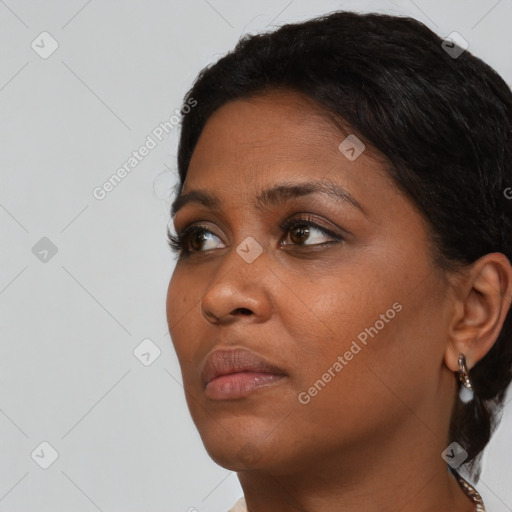 Neutral black young-adult female with short  brown hair and brown eyes