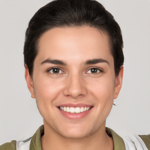 Joyful white young-adult male with medium  brown hair and brown eyes