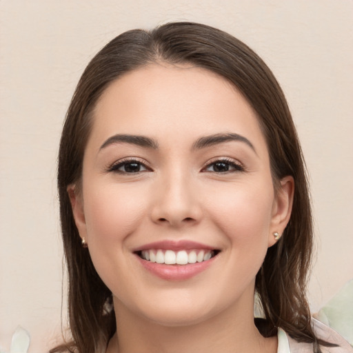 Joyful white young-adult female with medium  brown hair and brown eyes