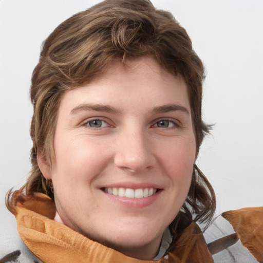 Joyful white young-adult male with medium  brown hair and grey eyes