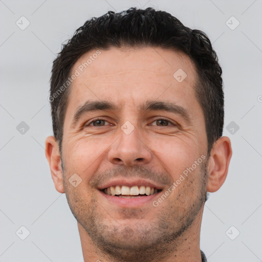 Joyful white young-adult male with short  brown hair and brown eyes