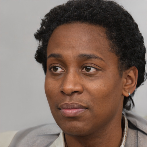 Neutral black young-adult female with short  black hair and brown eyes