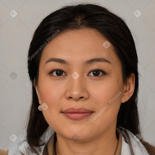 Joyful latino young-adult female with medium  brown hair and brown eyes