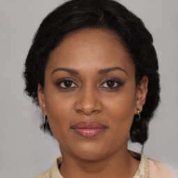 Joyful black young-adult female with medium  brown hair and brown eyes