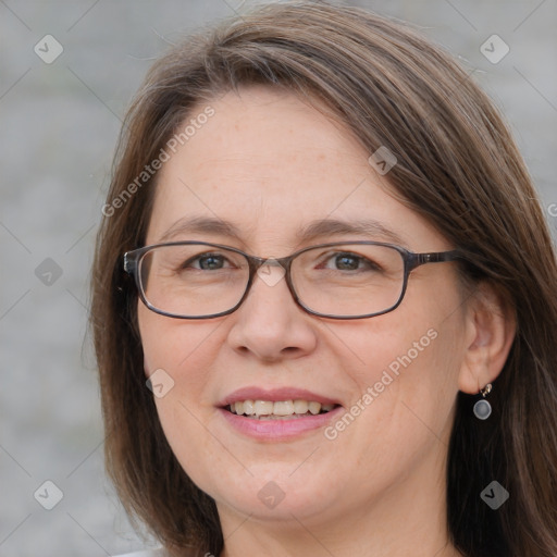 Joyful white adult female with medium  brown hair and blue eyes