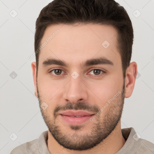 Joyful white young-adult male with short  brown hair and brown eyes