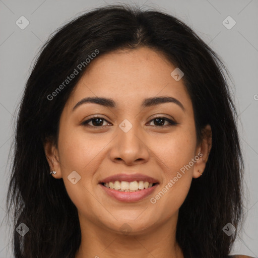 Joyful latino young-adult female with long  brown hair and brown eyes