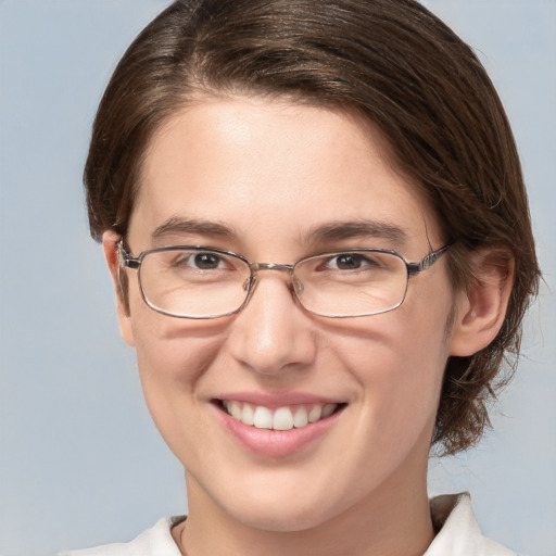 Joyful white young-adult female with medium  brown hair and grey eyes