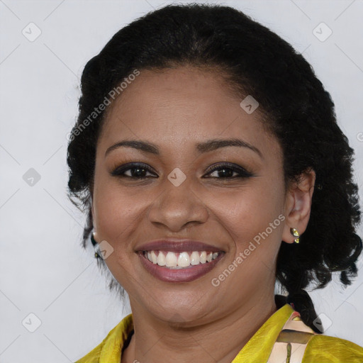 Joyful black young-adult female with medium  brown hair and brown eyes