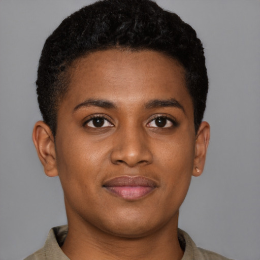 Joyful black young-adult female with short  brown hair and brown eyes