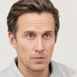 Neutral white adult male with short  brown hair and grey eyes