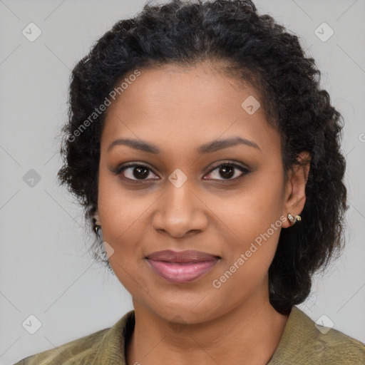 Joyful black young-adult female with long  brown hair and brown eyes