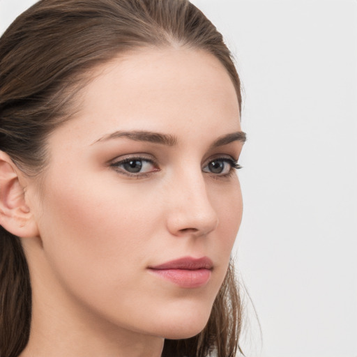 Neutral white young-adult female with long  brown hair and grey eyes