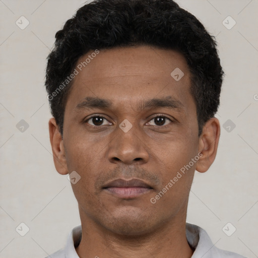 Neutral latino young-adult male with short  black hair and brown eyes
